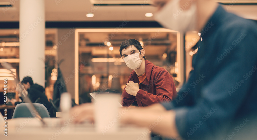 casual regular sitting at a table in a cafe. casual regular sitting at a table in a cafe.