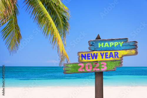 Canvastavla Hapy new year 2023 written on direction signs, tropical beach background, travel