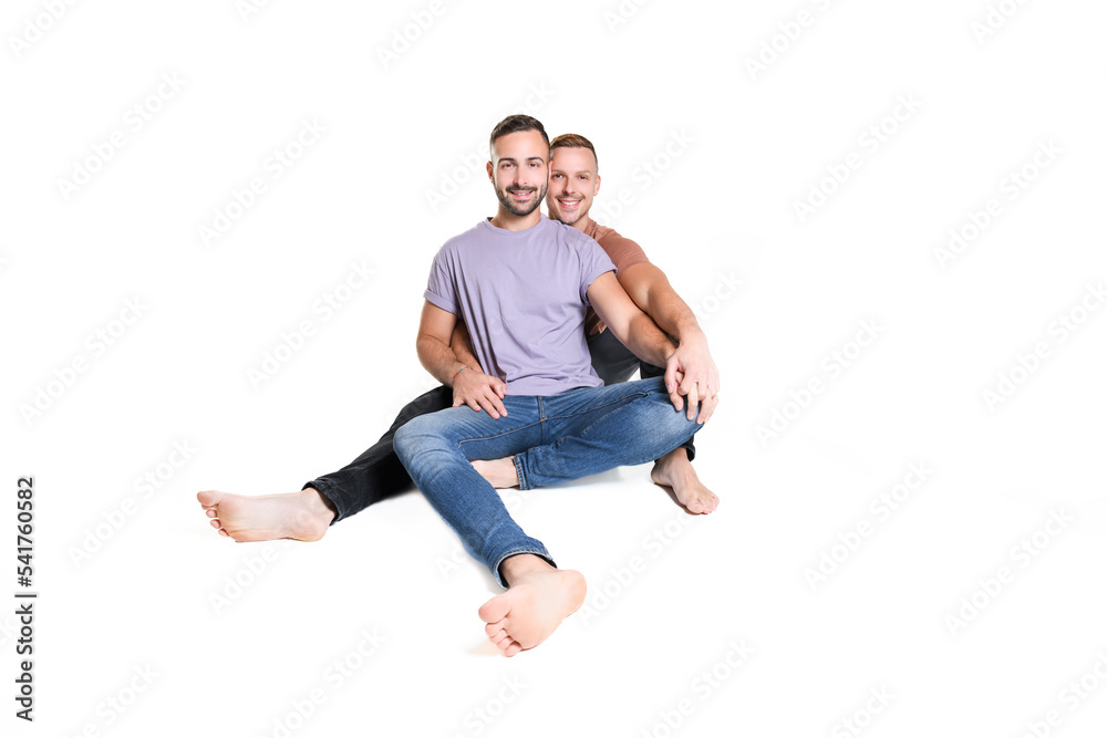 Two young men couple over white background on studio