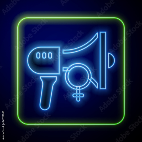 Glowing neon Female movement, feminist activist with banner and placards icon isolated on blue background. Feminist rights movement, feminism sisterhood. Vector