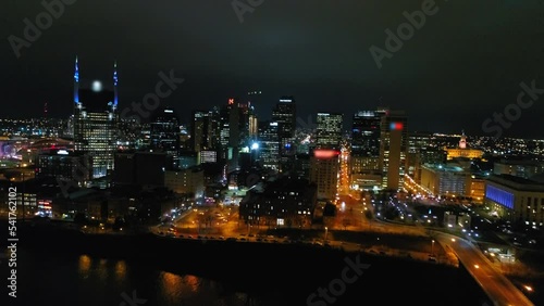 Wallpaper Mural Aerial Shot Of Illuminated Modern Buildings In City, Drone Flying Forward Over Cumberland River - Nashville, Tennessee Torontodigital.ca