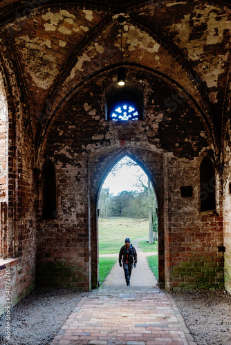 person walking through the arch