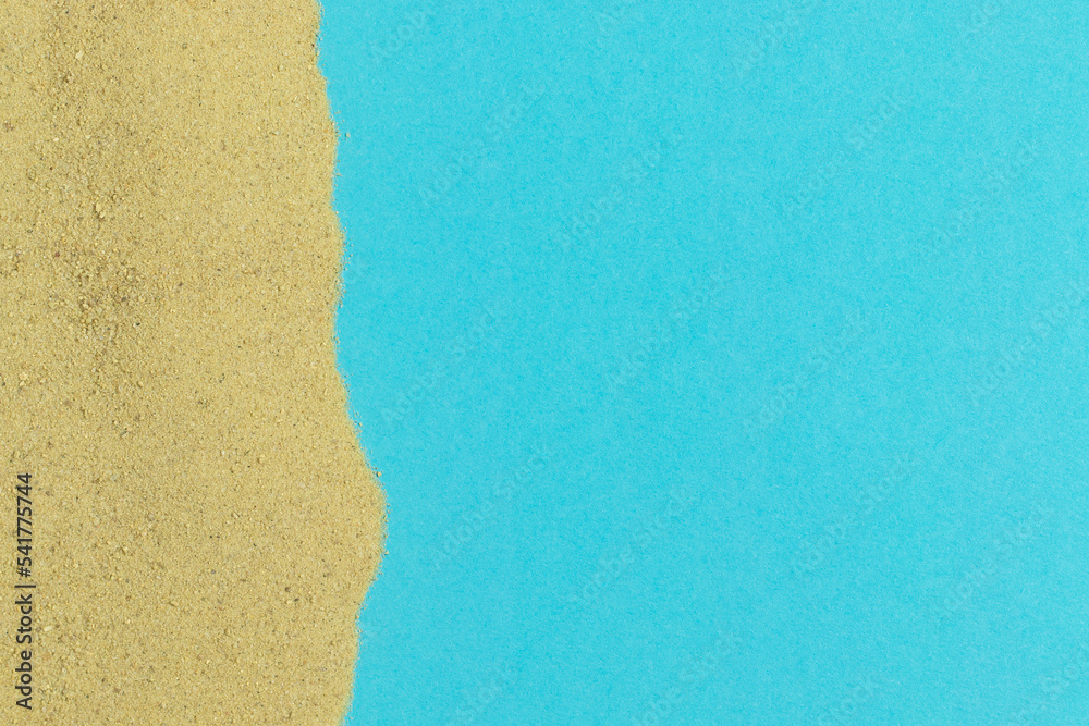 Summer vacation layout with yellow sand on blue background. Creative concept of a beach in minimalism style. Summer vacation layout with yellow sand on blue background. Creative concept of a beach in minimalism style.