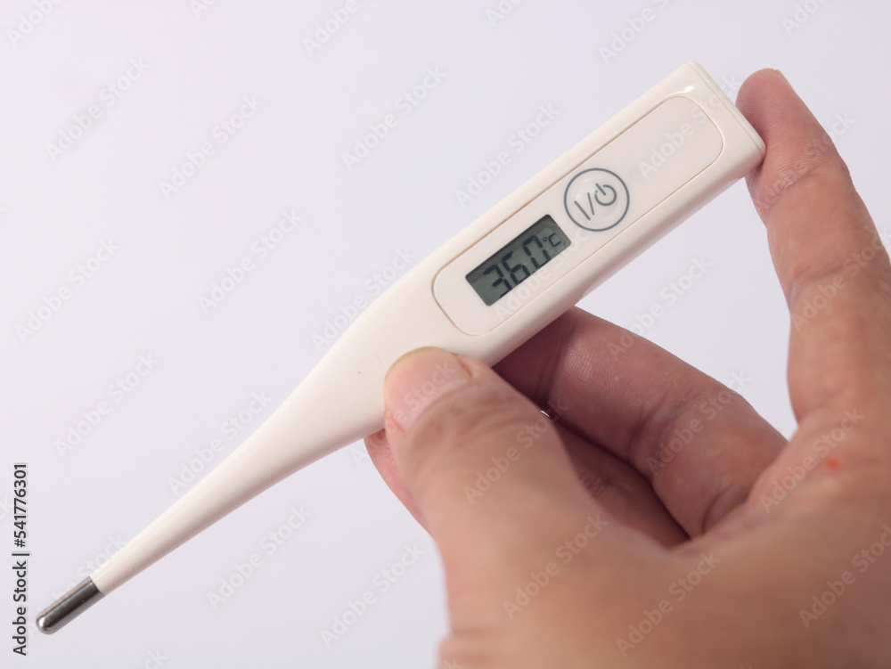 thermometer in hand, thermometer is a instrument used for measuring the temperature of the air, a person's body