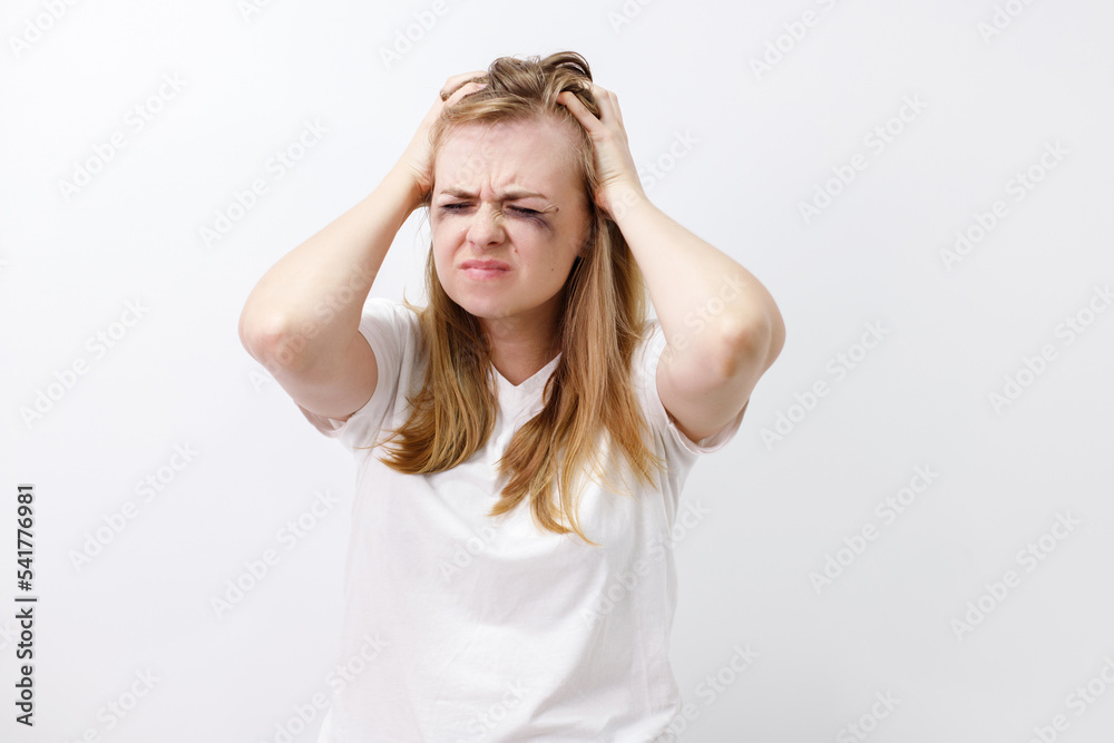depressed woman crying and holding her head depressed woman crying and holding her head