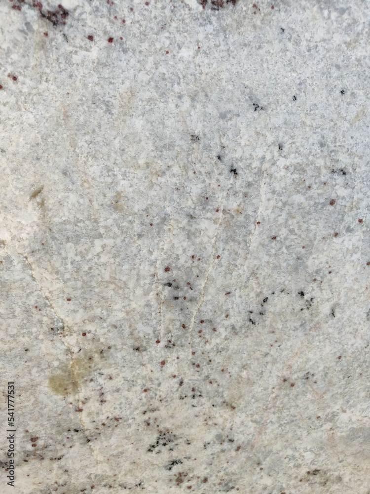 Natural white speckled marble/rock/stone surface material texture with grey black speckles detail Natural white speckled marble/rock/stone surface material texture with grey black speckles detail