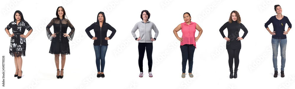 group of woman with arms akimbo on white background group of woman with arms akimbo on white background