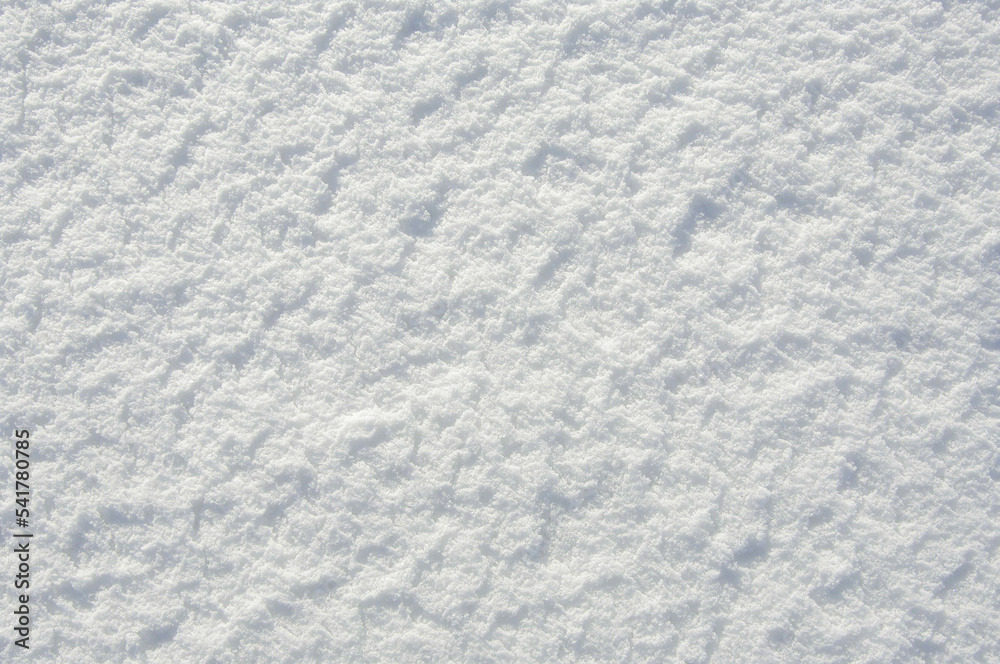 Snow texture with shadow for design. White texture. View from above.