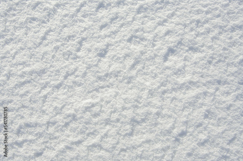 Snow texture with shadow for design. White texture. View from above.