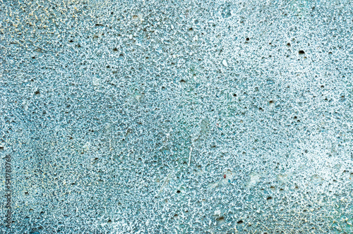 background, texture, abstraction - cement wall or old stone with uneven gray color with blue and green coating or old, worn paint.
