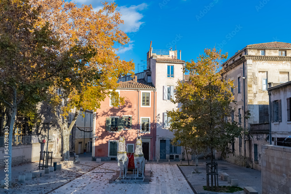 Nimes in France, old facades in the historic center, typical houses
