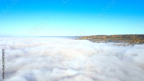 Fog clouds over the city, view from above © EdVal