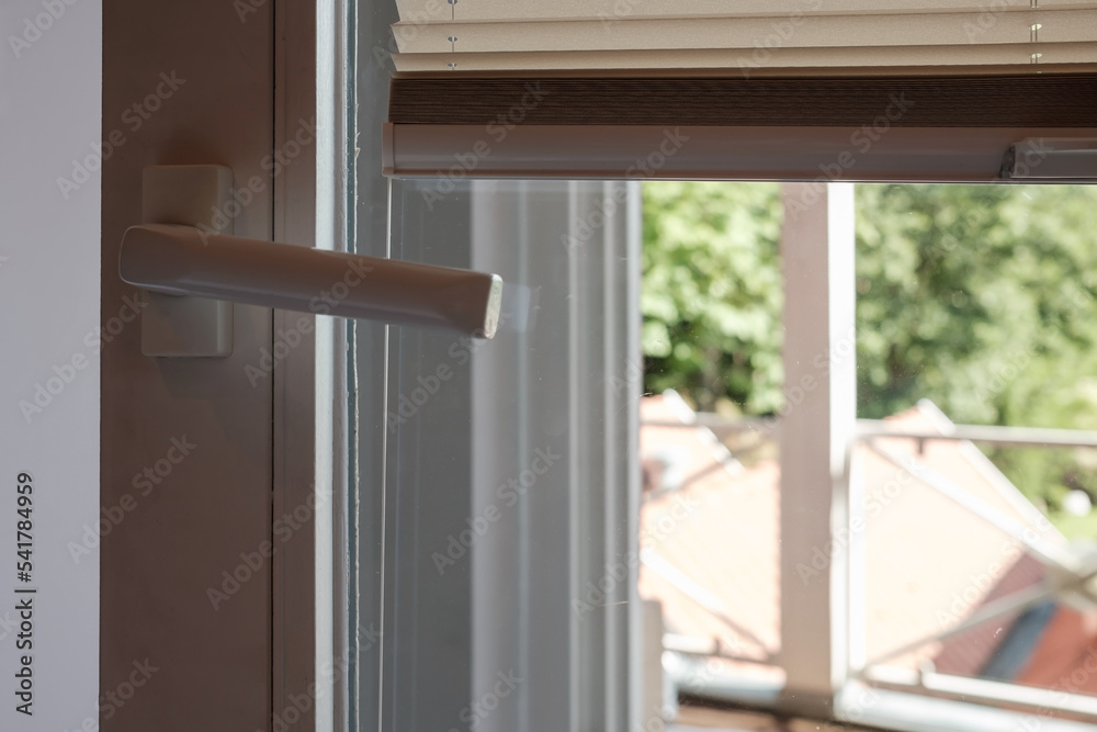 PVC door with raised blinds that protect from the sun. PVC door with raised blinds that protect from the sun.