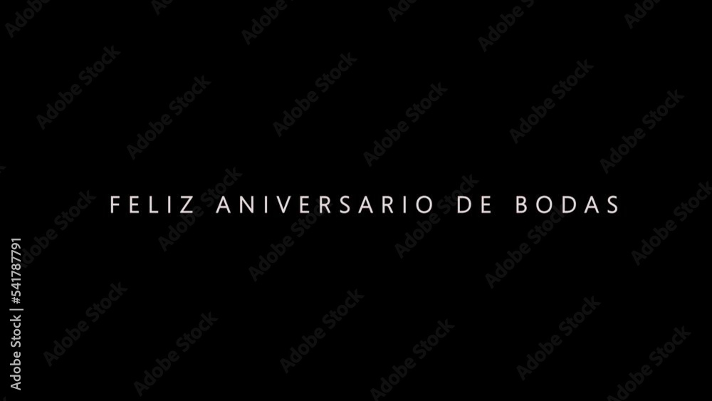 Happy Wedding Anniversary in Spanish Professional Cinematography Text in Dark Background
