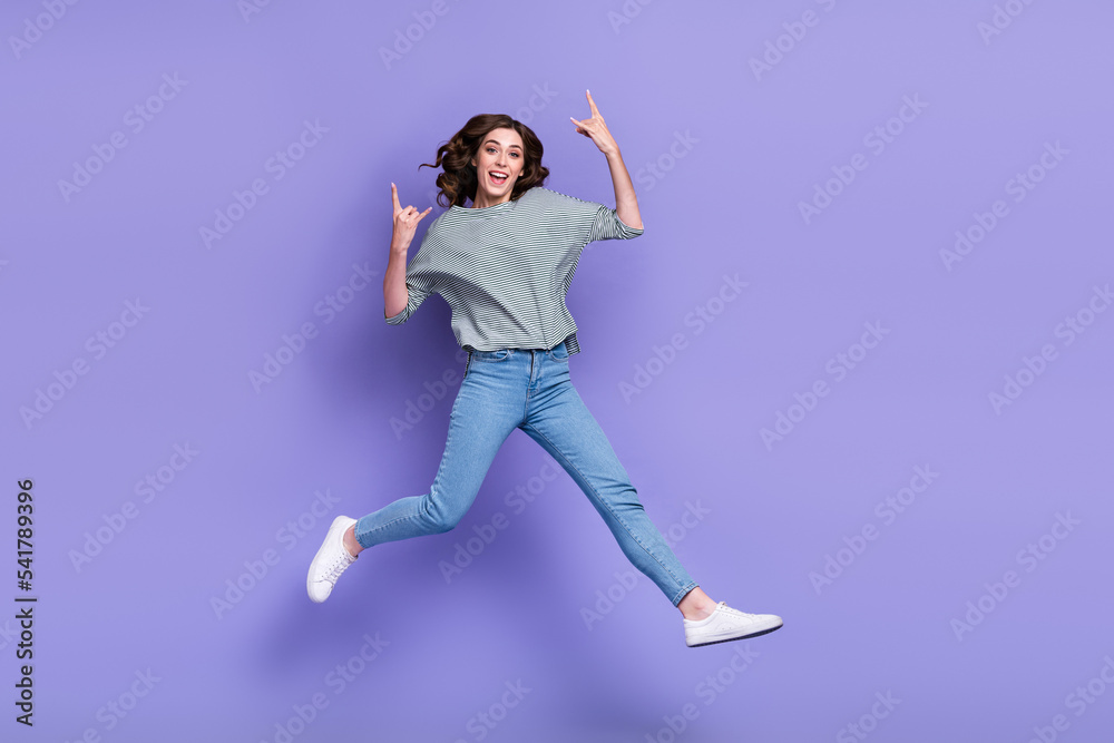 Full length photo of cheerful nice lady good mood rejoice go concert favorite singer empty space isolated on purple color background