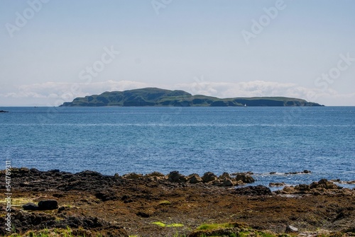 View of Sanda island in the sea on a sunny day photo
