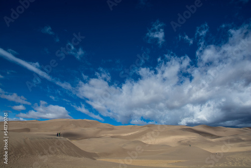 Amazing view to the Great Sand Dunes.. Dunes ant clouds in the sky. Very colorful landscape