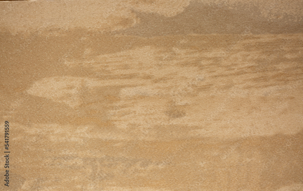 Obraz premium Brown background from decorative plaster with abstract spots. Unusual beige wall texture with beautiful patterns, creative surface background. Front covering for facing of buildings.