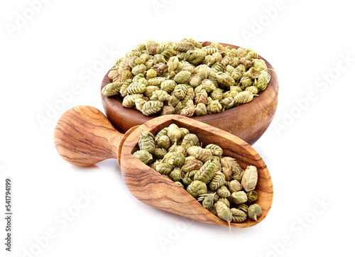 Thyme spice in wooden spoon isolated on white background. Oregano ball. Thymus vulgaris.