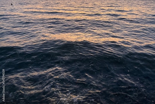 sea surface with evening sky reflection