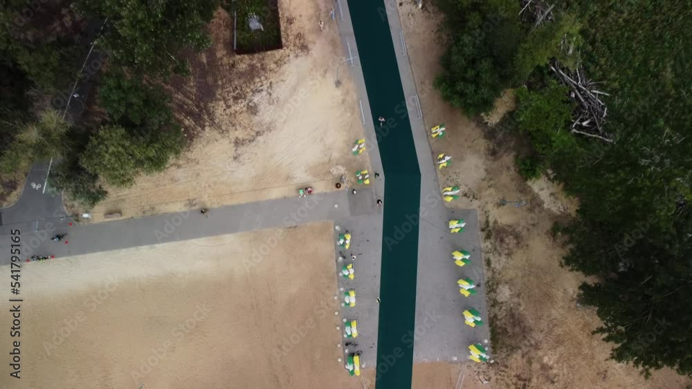 Athletes are running long distance during triathlon held in Russia. Sportsmen are taking part in race filmed from above by drone. People are jogging on special rode in park. Athletes are running long distance during triathlon held in Russia. Sportsmen are taking part in race filmed from above by drone. People are jogging on special rode in park.