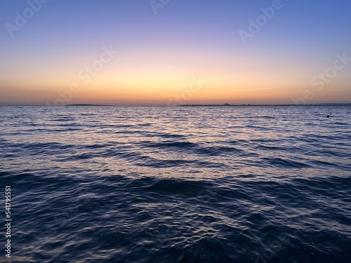 Beautiful orange sea horizon  evening beach