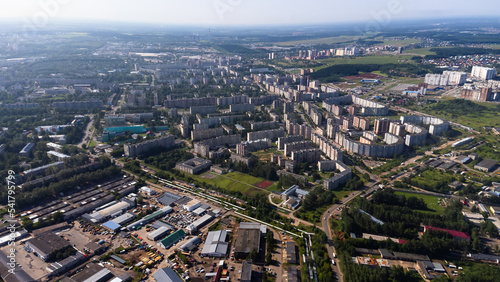 City, locality. Construction site, residential area on a sunny summer day. Apartment buildings, high-rise buildings. The view from the drone, from above. © Павел Шульмин