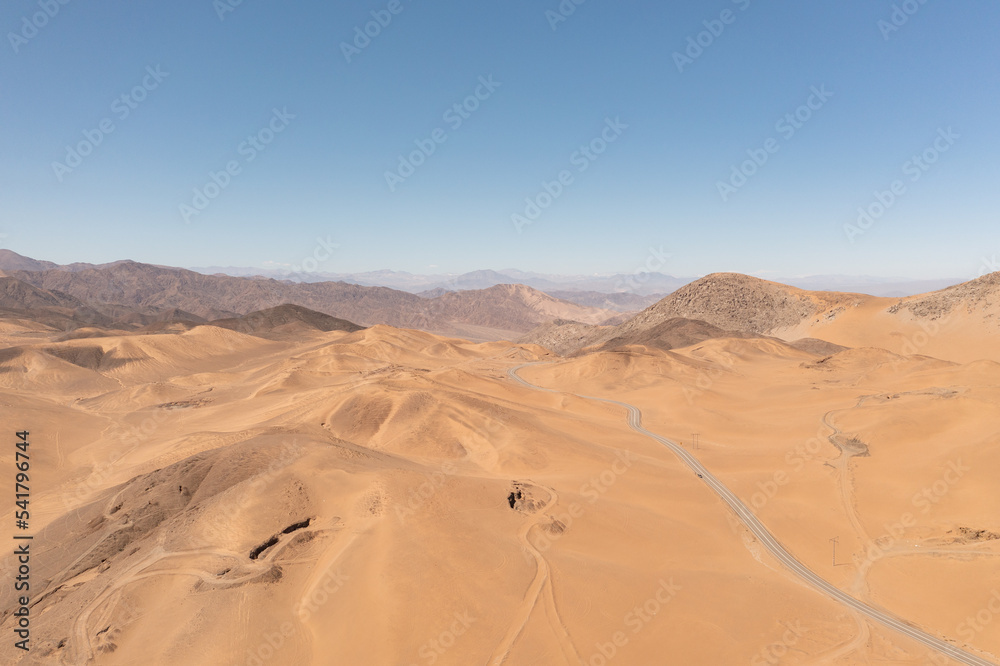Aerial view of mountains and a road in the atacama desert near the city of Copiapó