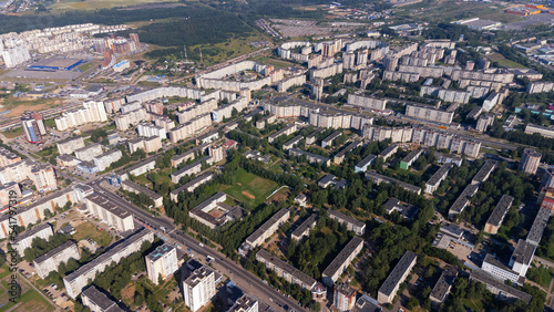 City, locality. Construction site, residential area on a sunny summer day. Apartment buildings, high-rise buildings. The view from the drone, from above. © Павел Шульмин