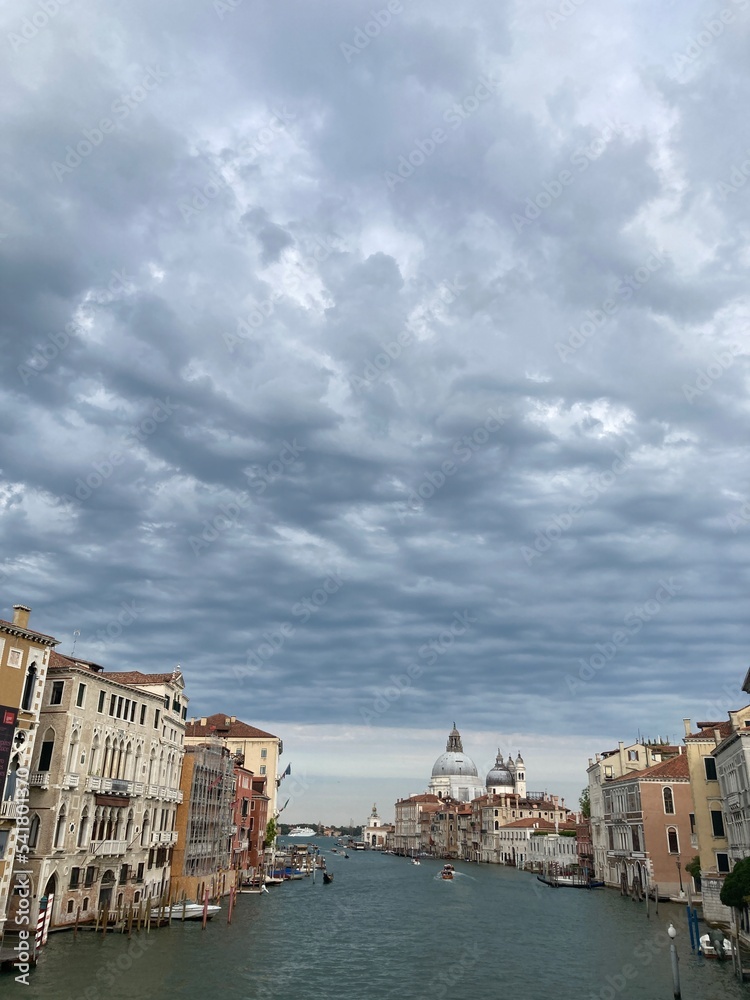 view of Maria della Salute from ponte dell Accademia with stormy sky, Venice, Italy