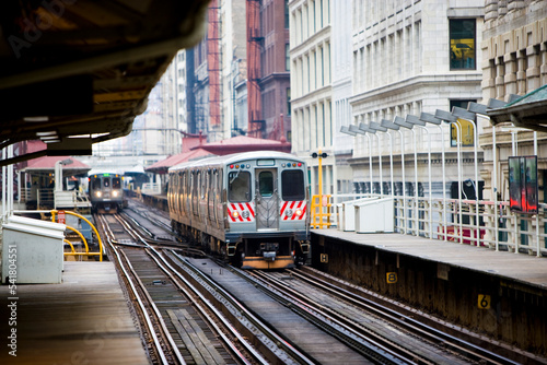 Elevated mass transit trains run along the Loop in Chicago, Illinois.