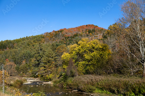 Autumn landscape with river is seen from Route 110  Vermont  USA