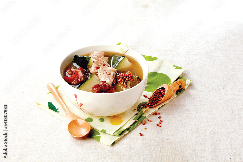 Fototapeta premium Winter Melon and Lotus Fragrant Red Barley and Snails and Pork Tendon Soup served in a bowl isolated on napkin side view of hong kong food