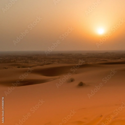 Desert sand dunes with hazy sunny sky