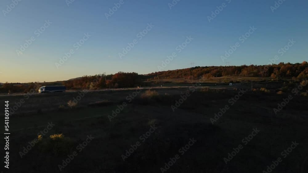 truck drive transport on the road aerial drone top view in autumn day truck drive transport on the road aerial drone top view in autumn day