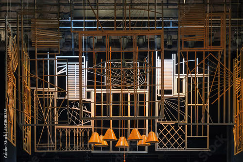 The abstract yellow metal constructions with black background on the theater stage photo