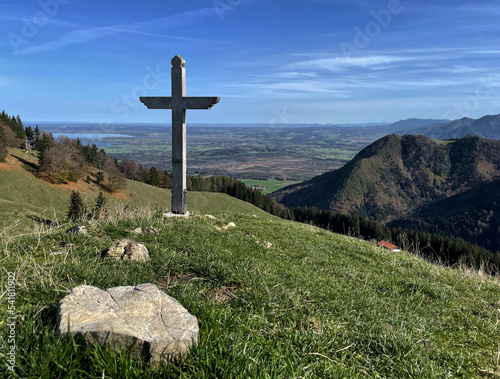 Gipfelkreuz mit Aussicht am Erlbergkopf im Herbst mit Stein im Vordergrund, Chiemgau, Bayern, Deutschland, Alpen photo