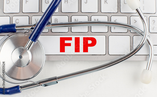 FIP text on keyboard with stethoscope , medical concept photo
