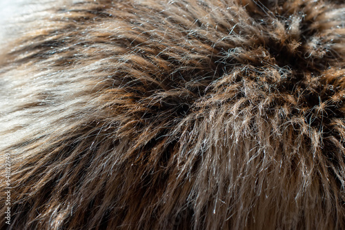 Grey-brown faux fur with long pile, close up