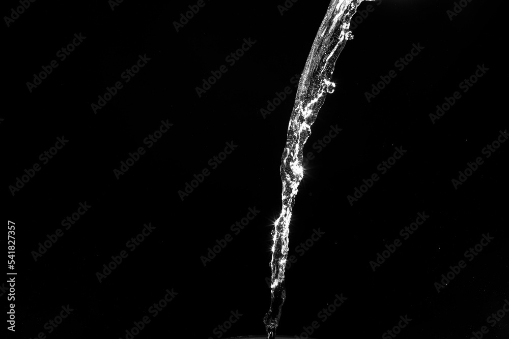 water splashes isolated on black background. white jets with drops water splashes isolated on black background. white jets with drops