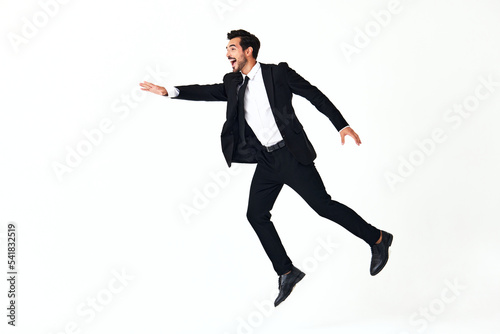 Man business smile with teeth in costume running and jumping up open mouth happiness and surprise full-length on white isolated background copy place 