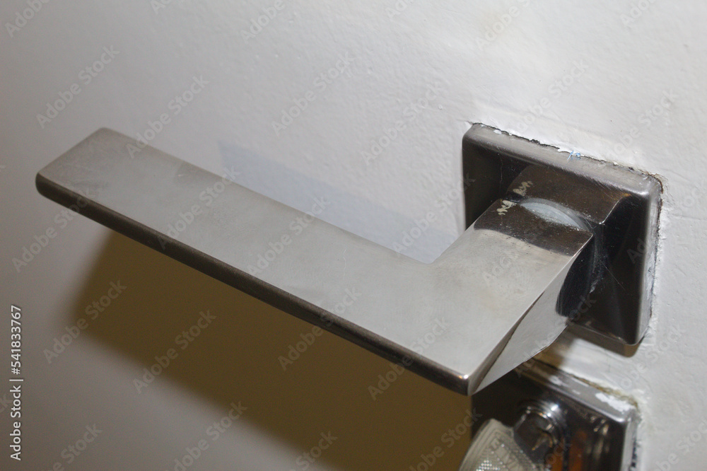 Lock and door handle made of silver metal Photos Adobe Stock