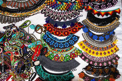 Colorful necklaces and bracelets made of beads are traditional for the ethnic group Saraguro, Loja province, Ecuador. photo