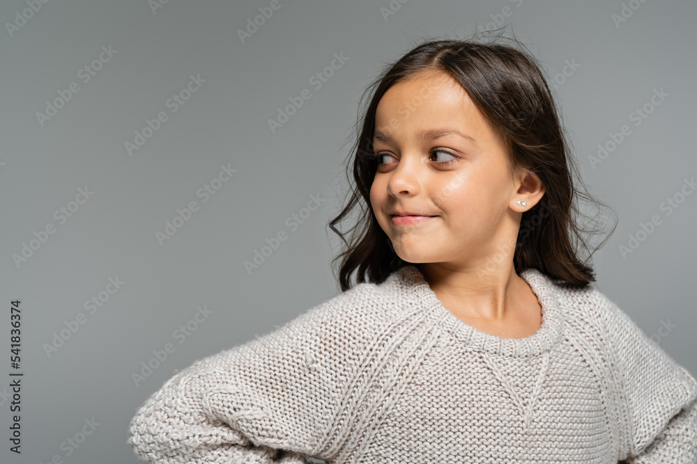 brunette girl in warm sweater smiling and looking away isolated on grey brunette girl in warm sweater smiling and looking away isolated on grey