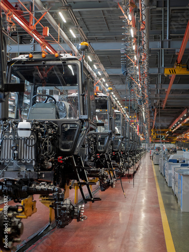 Tractor assembly line in a production building, Tractor cabs in the assembly hal Fototapet