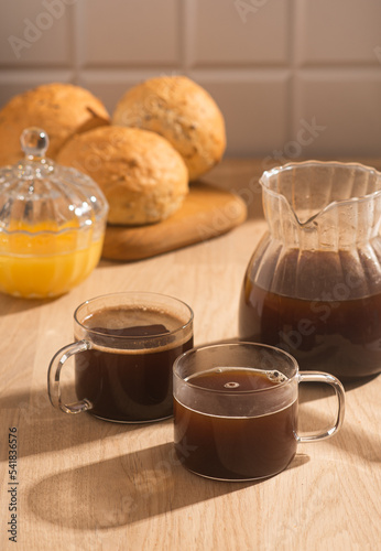 Americano in glass cups stands being poured from Turks