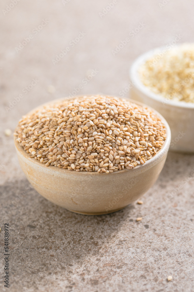 Set with different sesame seeds on stone background. top view. Set with different sesame seeds on stone background. top view.