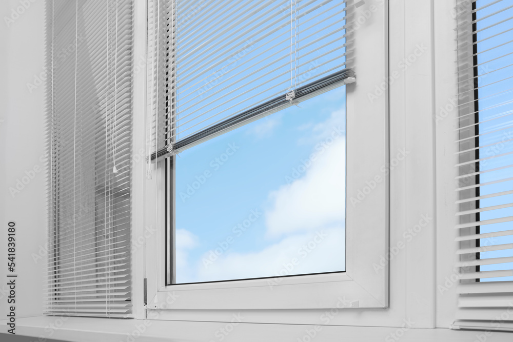 Window with horizontal blinds indoors, low angle view Window with horizontal blinds indoors, low angle view