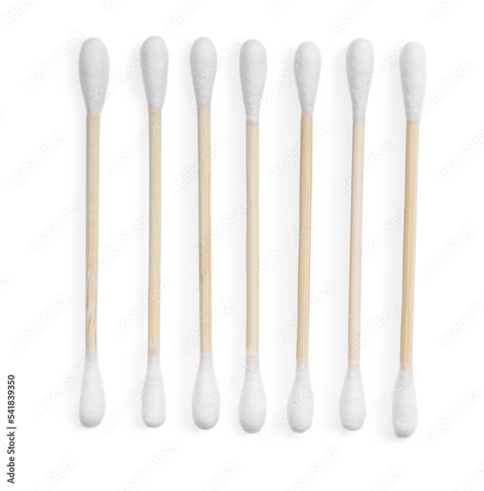 Wooden cotton buds on white background, top view Wooden cotton buds on white background, top view