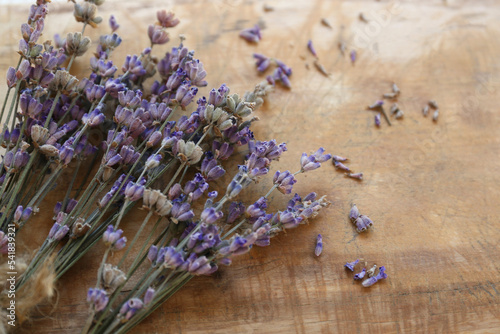 Bouquets of beautiful lavender flowers on wooden table, closeup. Space for text